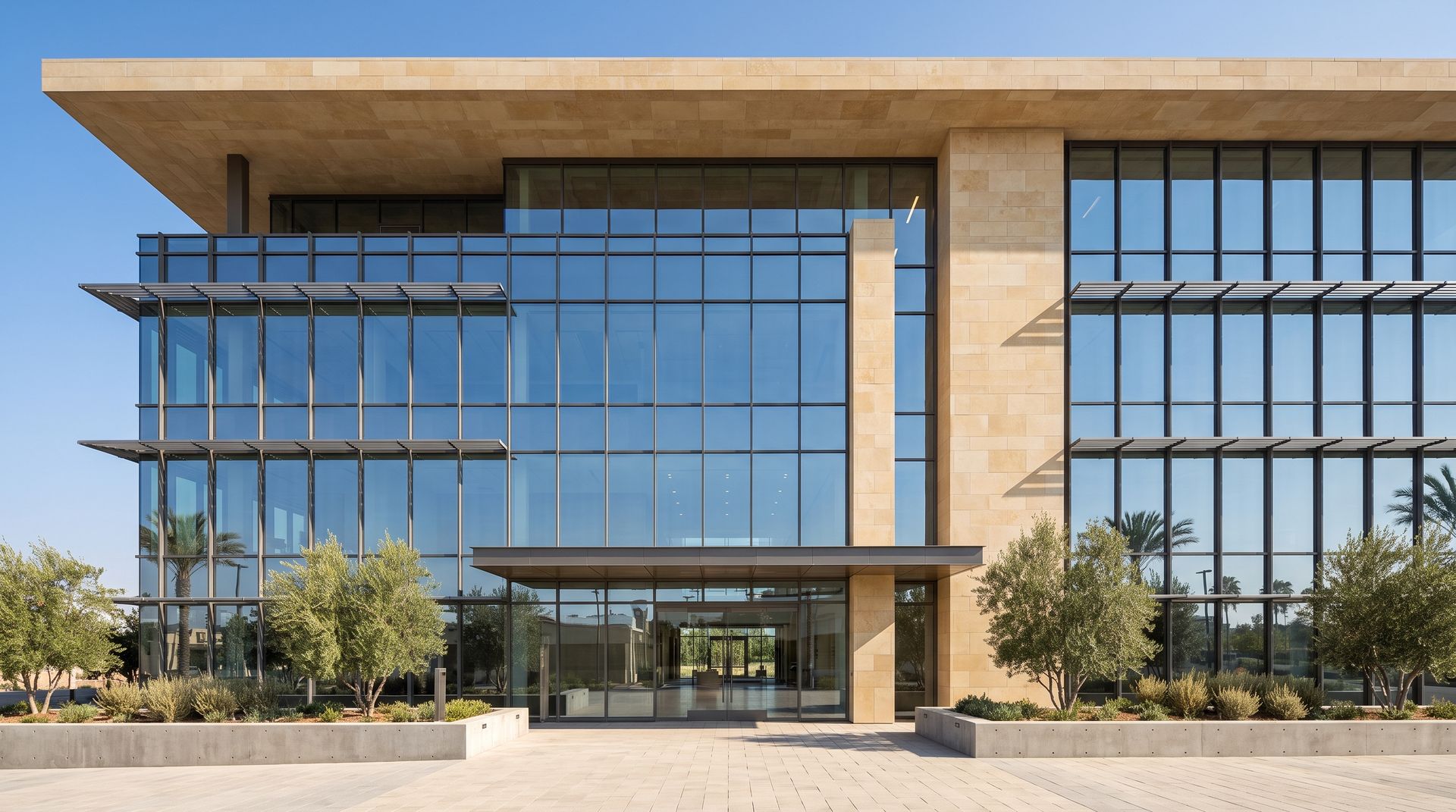Photorealistic render of a four-storey office building with a glass curtain wall, limestone piers and horizontal sunshades